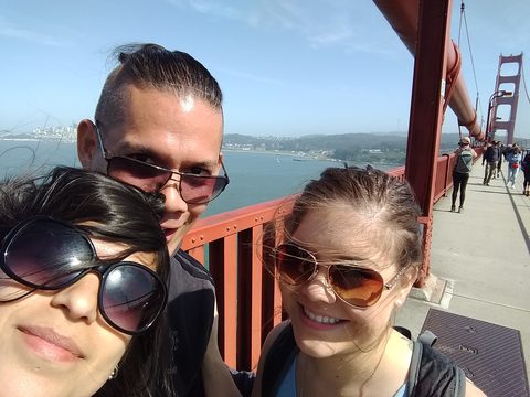 A group of friends enjoying the view on a sunny day at an iconic bridge. MJ and Cisco and Liz, Golden Gate Bridge, Sausalito, USA, May 7, 2017