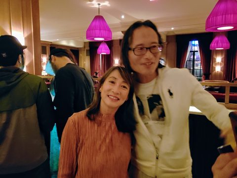 A smiling couple poses로 own```json way in a warmly lit restaurant. Richard, Park MGM Las Vegas, Paradise, USA, December 2, 2018