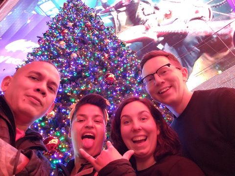 A group of four friends smiles for a selfie in front of a large own own``` bar. MJ and Cisco and Ash and Rebecca, Fremont Hotel & Casino, Las Vegas, USA, December 23, 2021